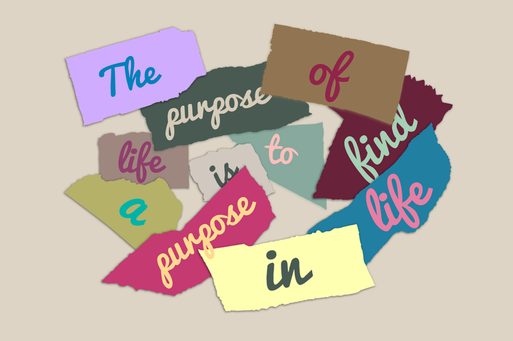 Image of words piled on colorful paper.