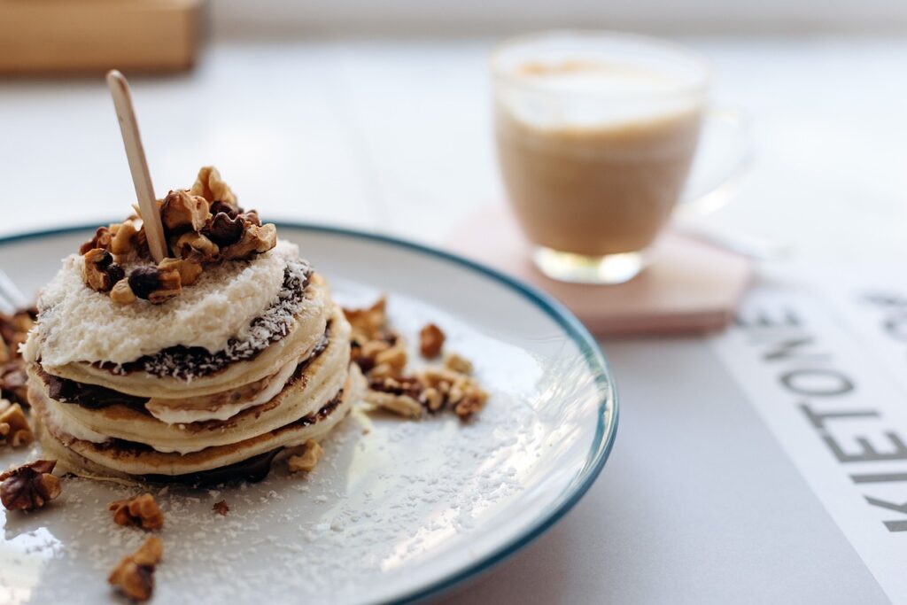 Image of pancakes and a drink on a table.