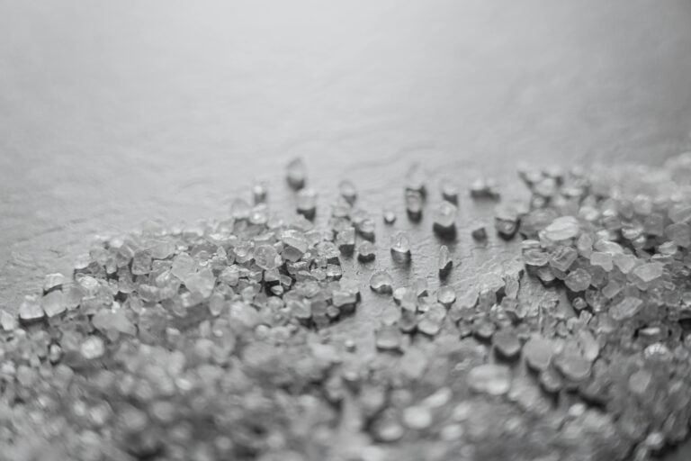 Image of salt on a white table.