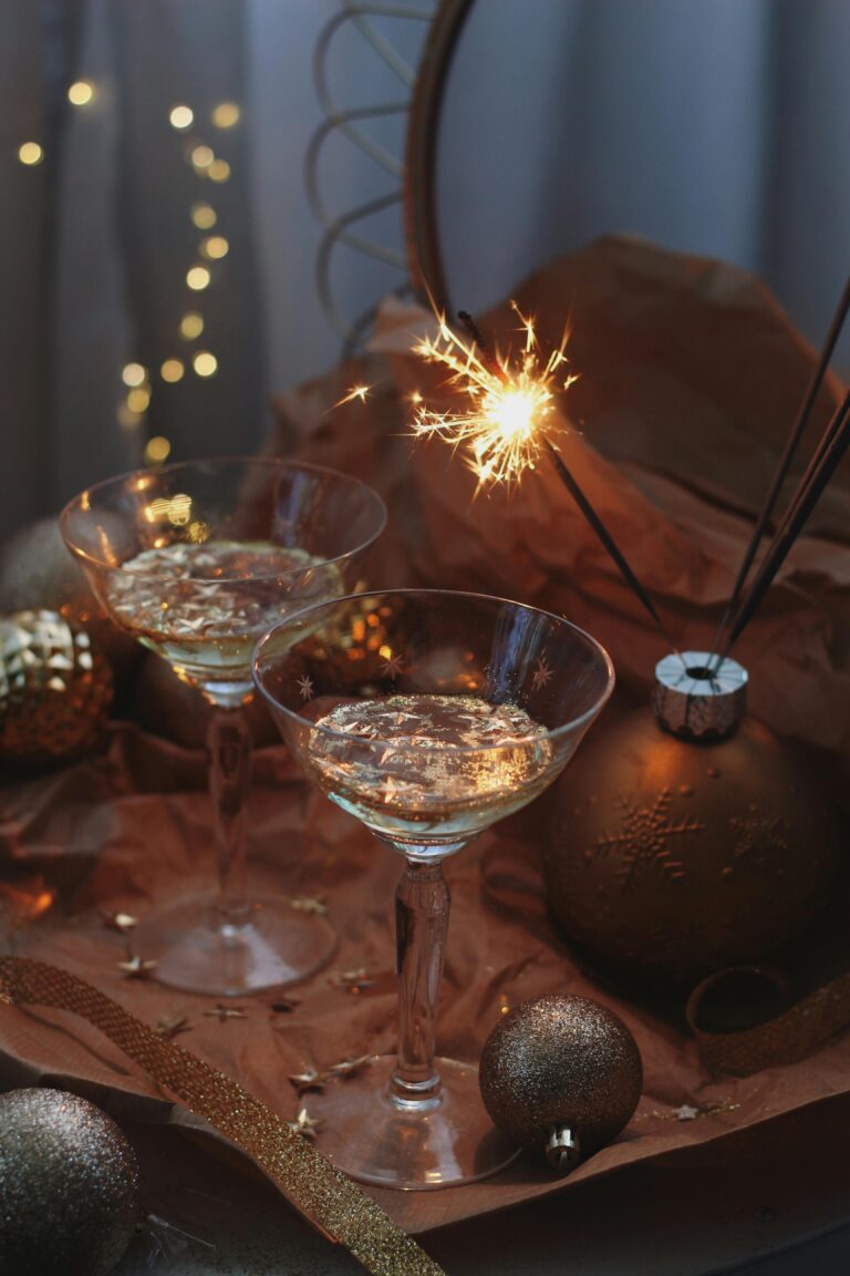 Image of drinks and sparkling candles on a table.