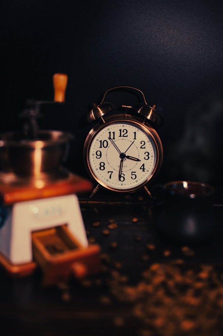 An image of a clock with a dark background.