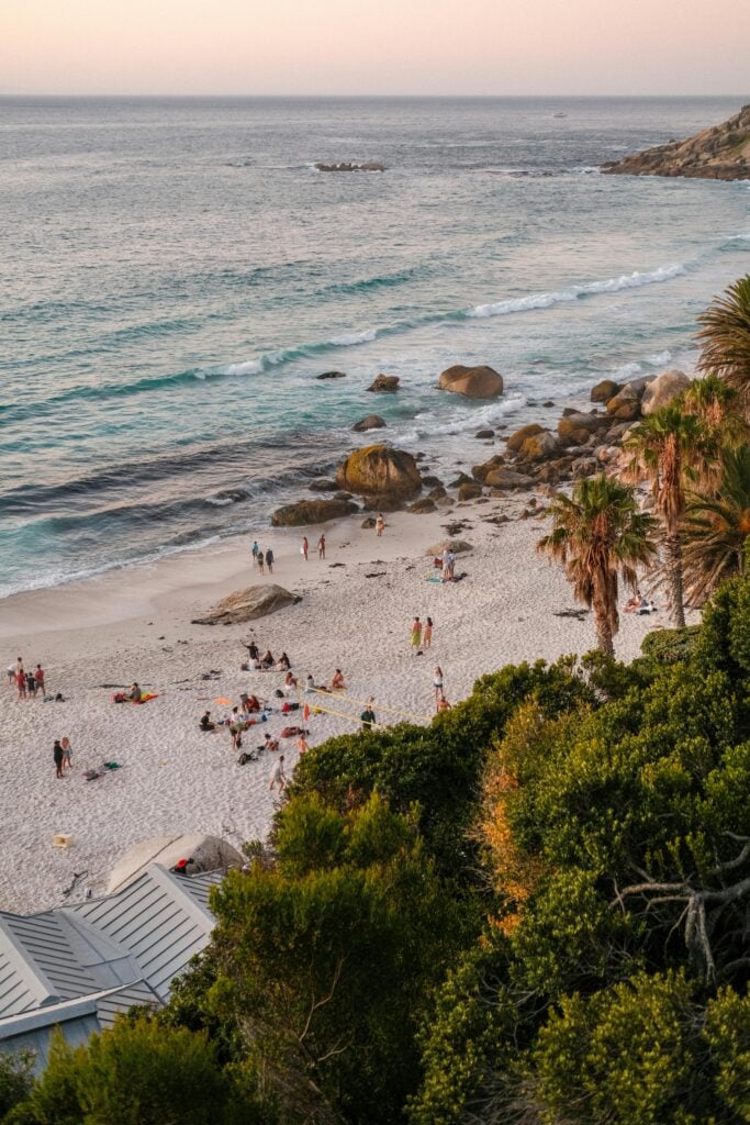 Image of a beach with people in an overview shot.