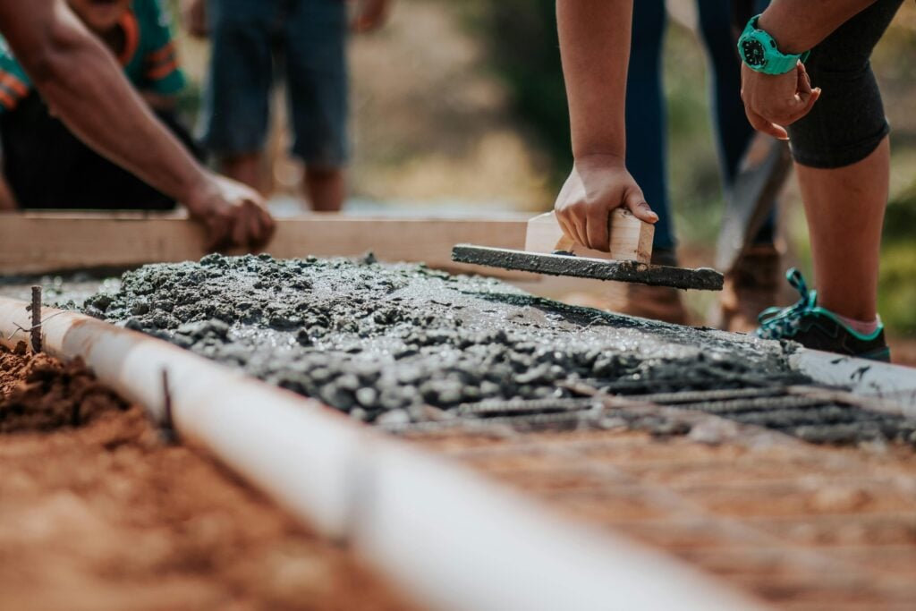 Image of people working on pavement.