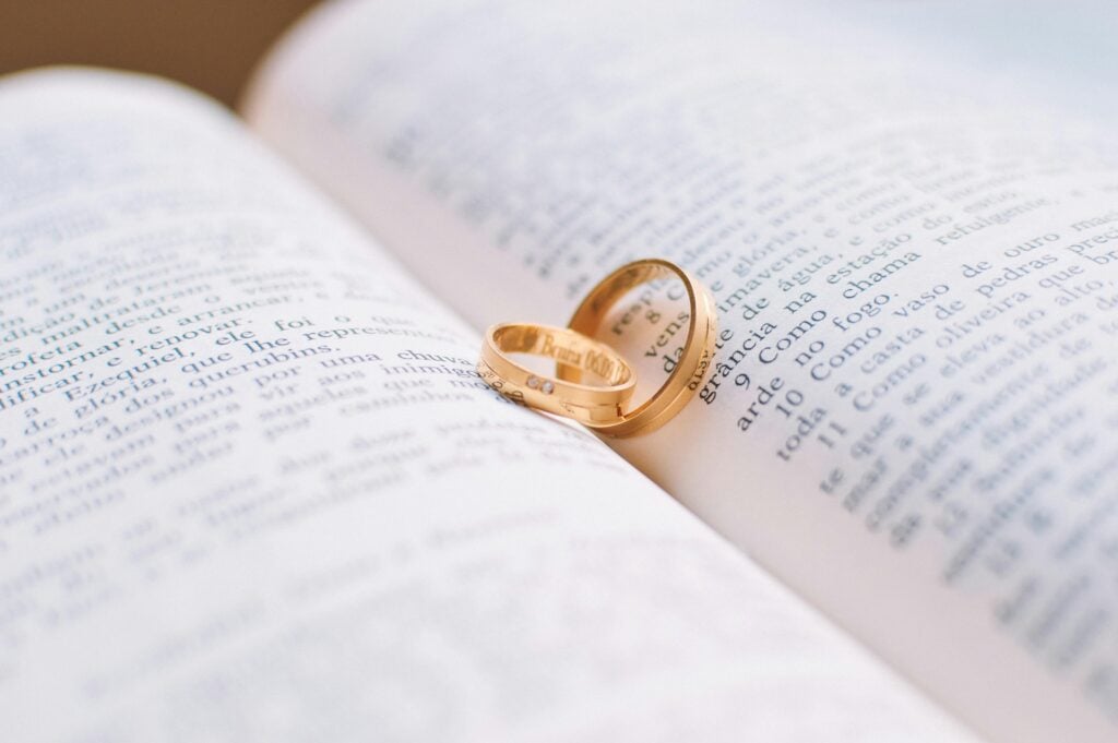 Image of wedding bands on an open bible.