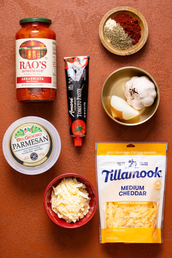 Ingredients on a burnt orange table.