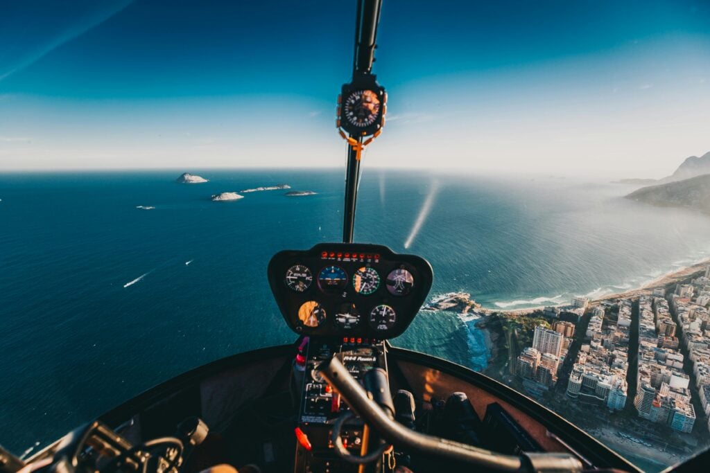 Pilot view of an ocean as a plane flies in the air.
