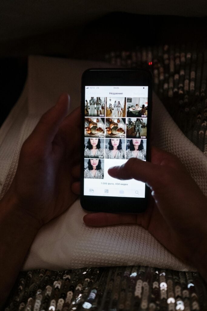 Someone's hands scrolling a phone.