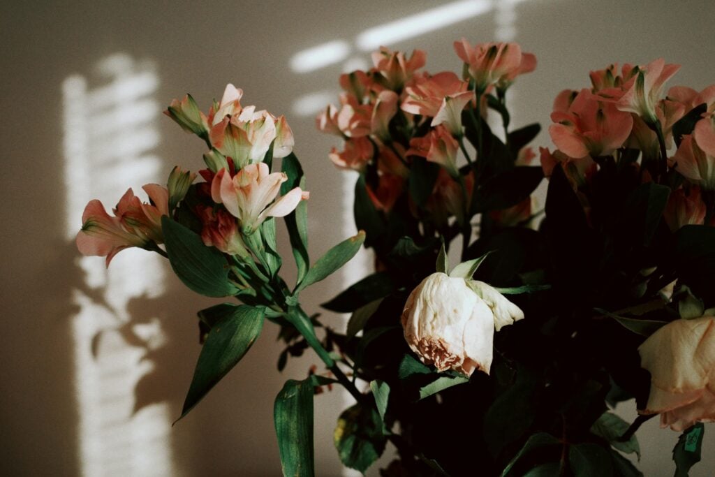 A bouquet of flowers with a few wilted.