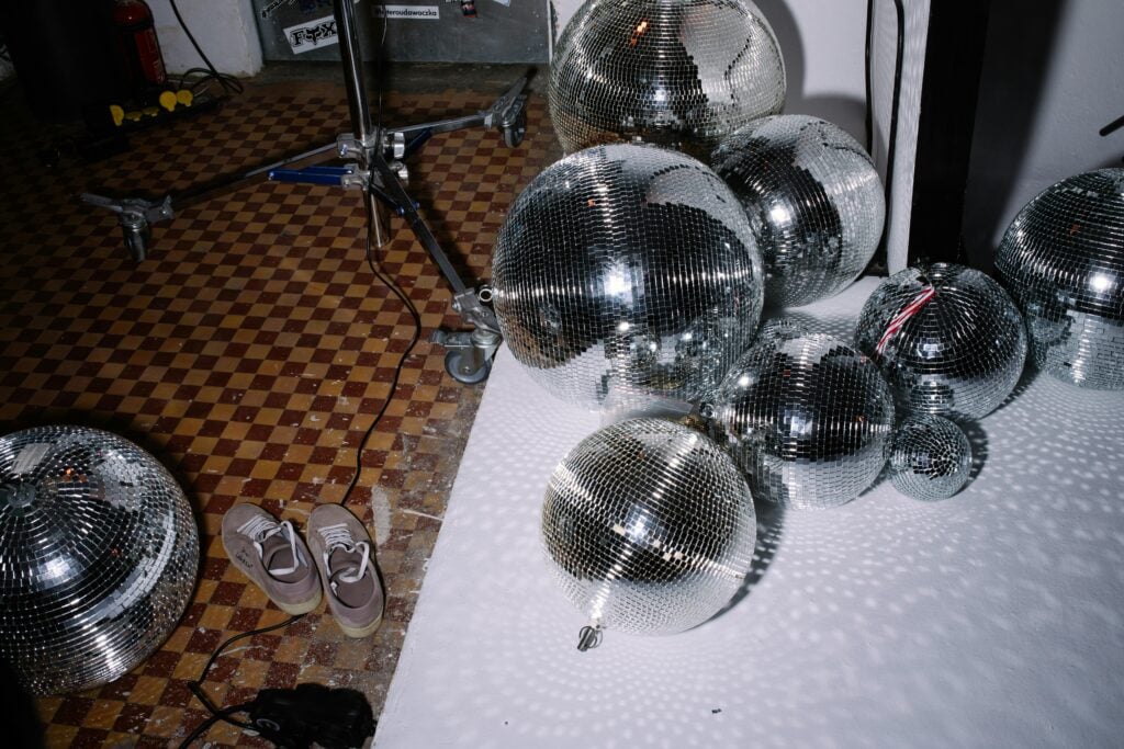 A room with disco balls and shoes.
