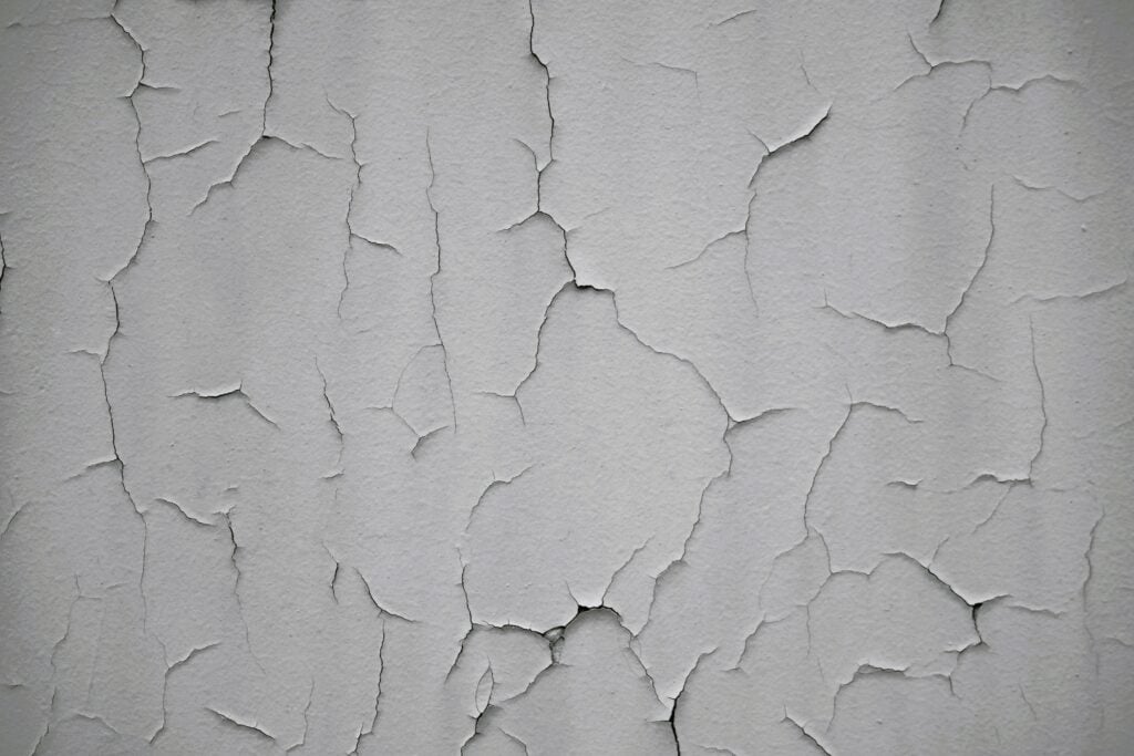 Cracked grey wall.