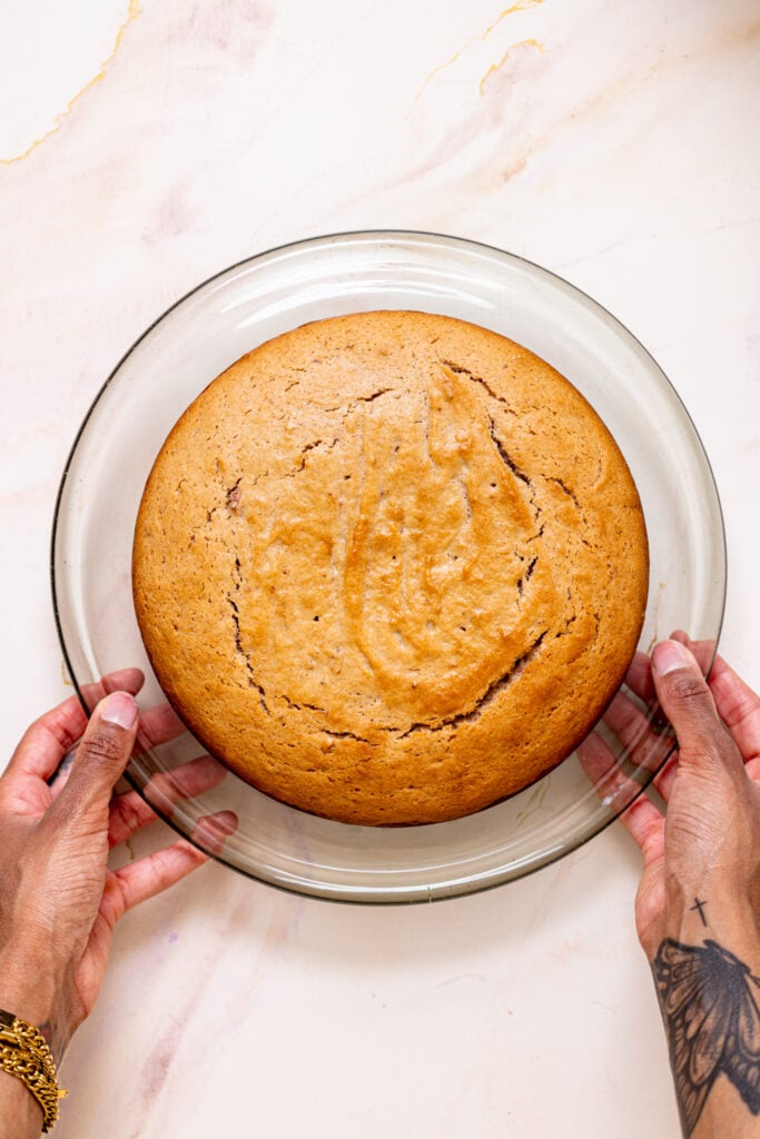 Baked strawberry cake on a cake stand.