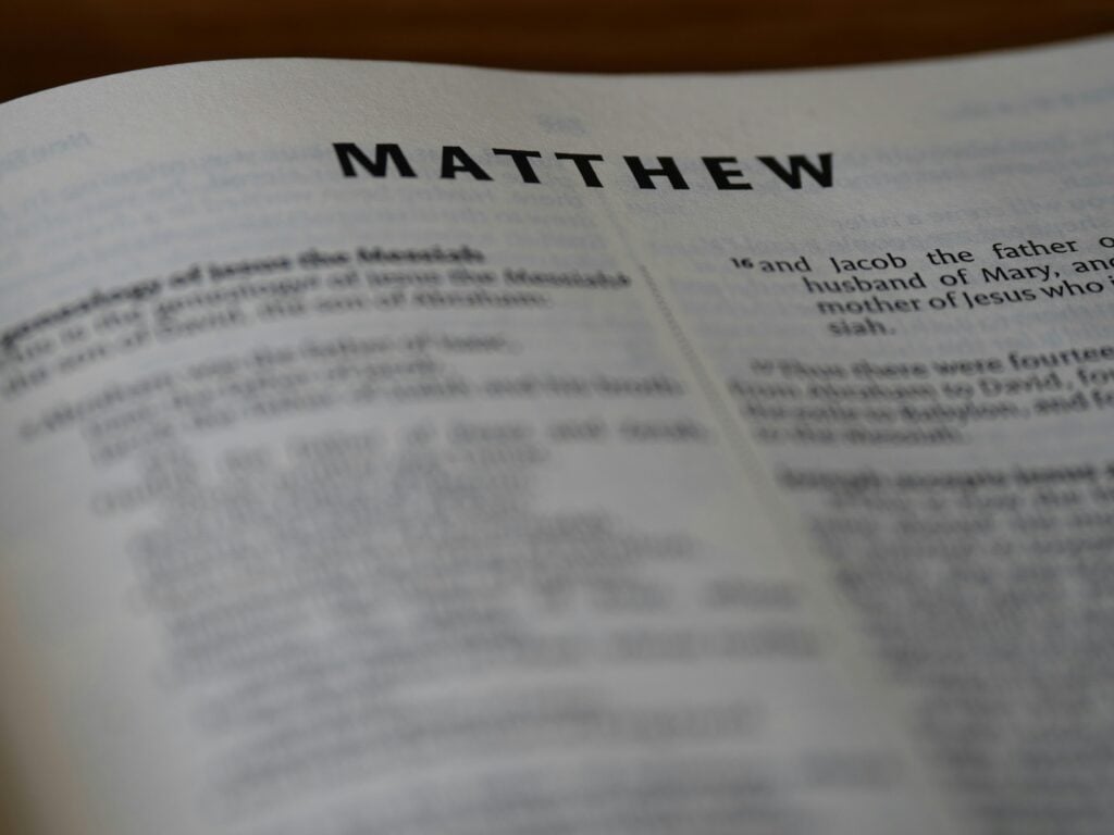 An open bible with the book of Matthew.