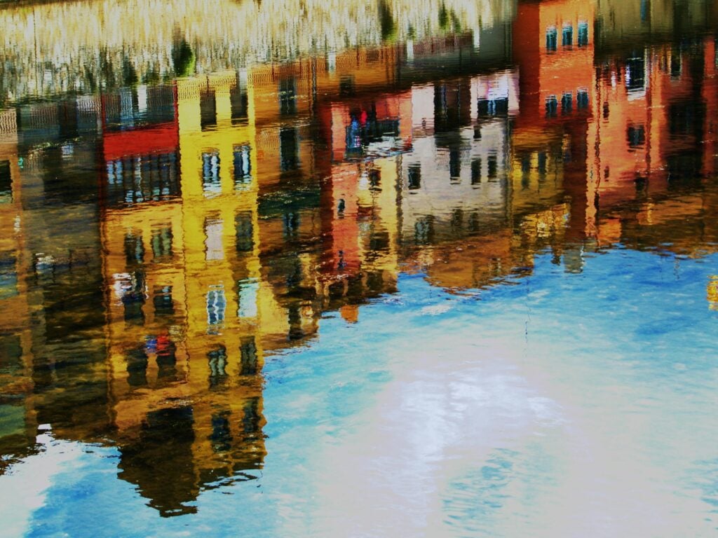 Reflection of colorful houses in the water.