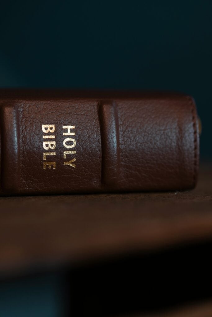 Image of side of holy bible on a table.
