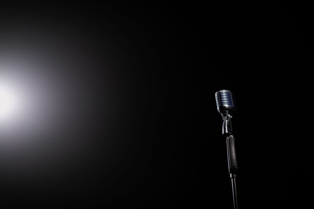 A mic with a black background and a spot of light.